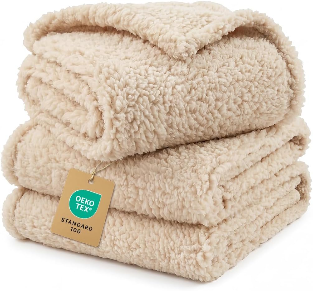 Folded sherpa fleece blanket in warm cream