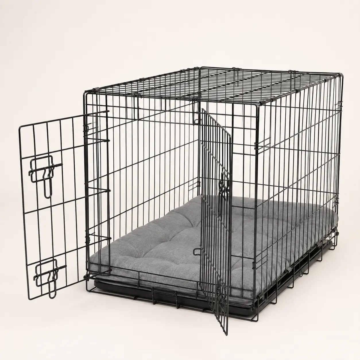 Wire dog crate with a metal divider panel for puppy growth
